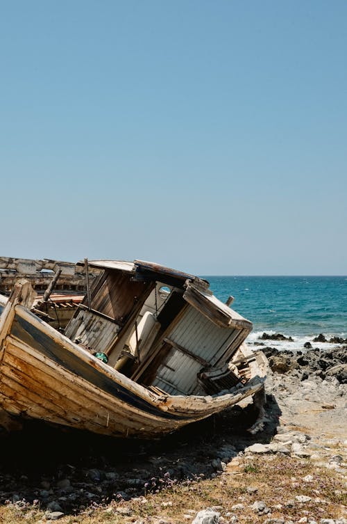 Brown Wooden Boat on the Shore