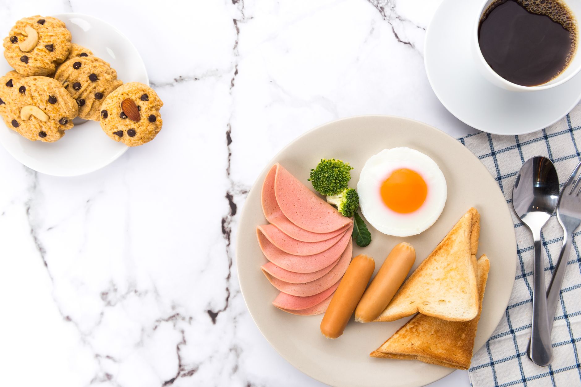 Slices of canned luncheon meat on breakfast plate