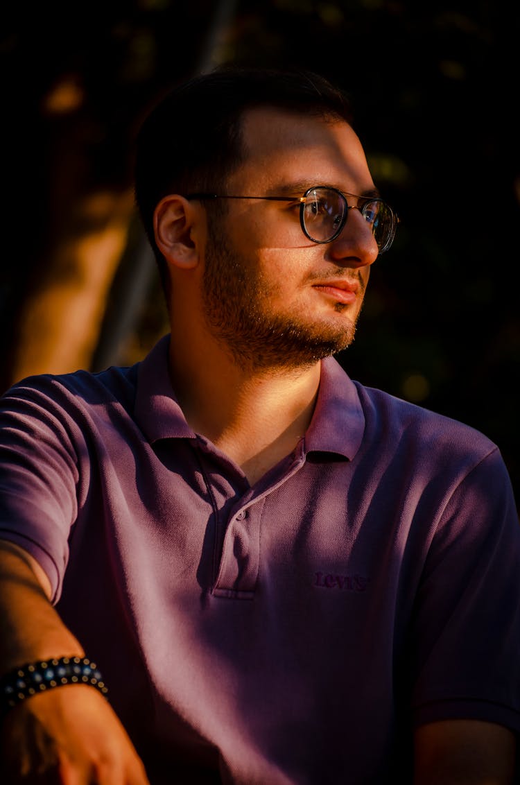 Man In Purple Polo Shirt Wearing Eyeglasses