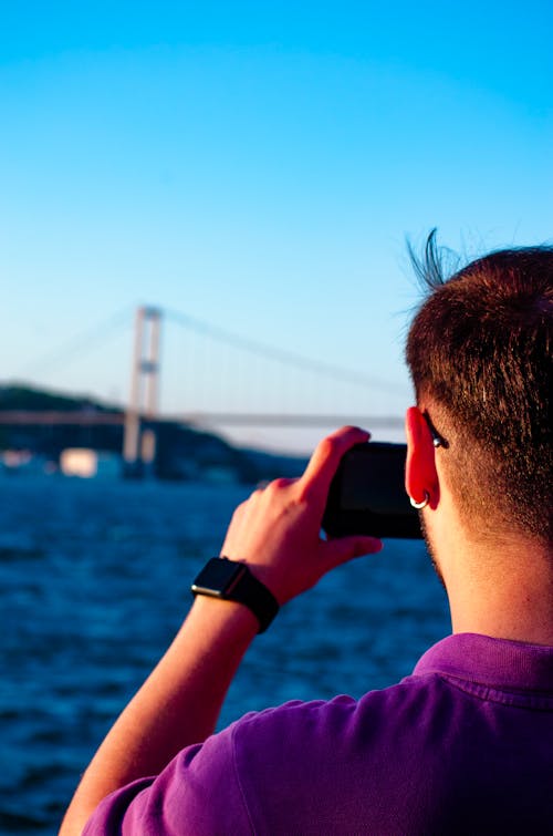 Man Taking Photo with a Cellphone