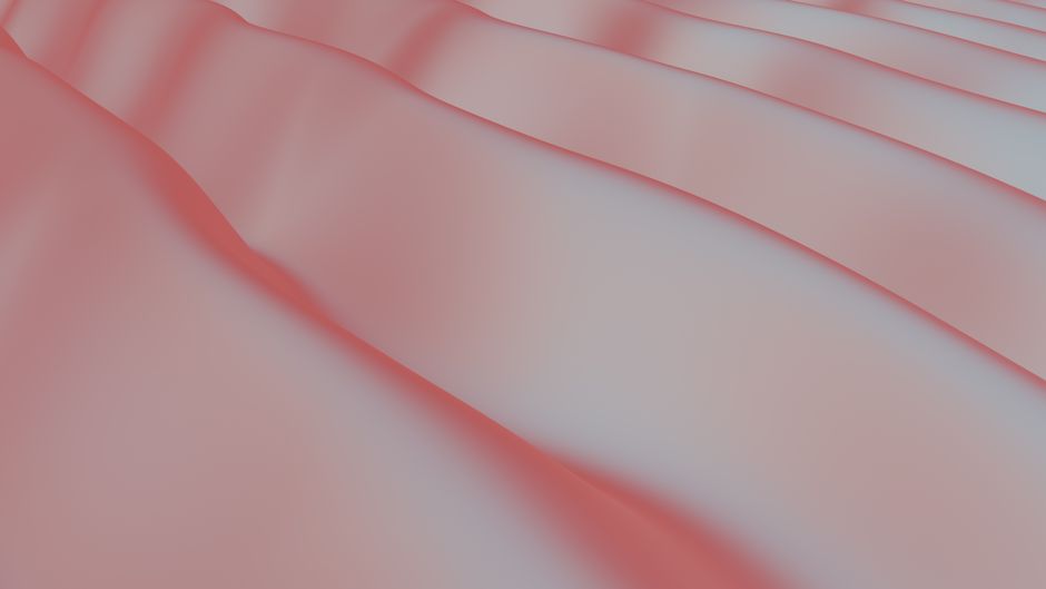 Elegant pink silk fabric with smooth waves, ideal for backgrounds or wallpapers.