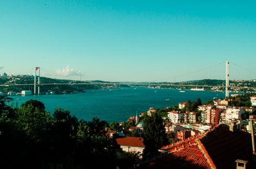 Free Breathtaking view of the Bosphorus Bridge spanning over the blue waters of Istanbul. Stock Photo