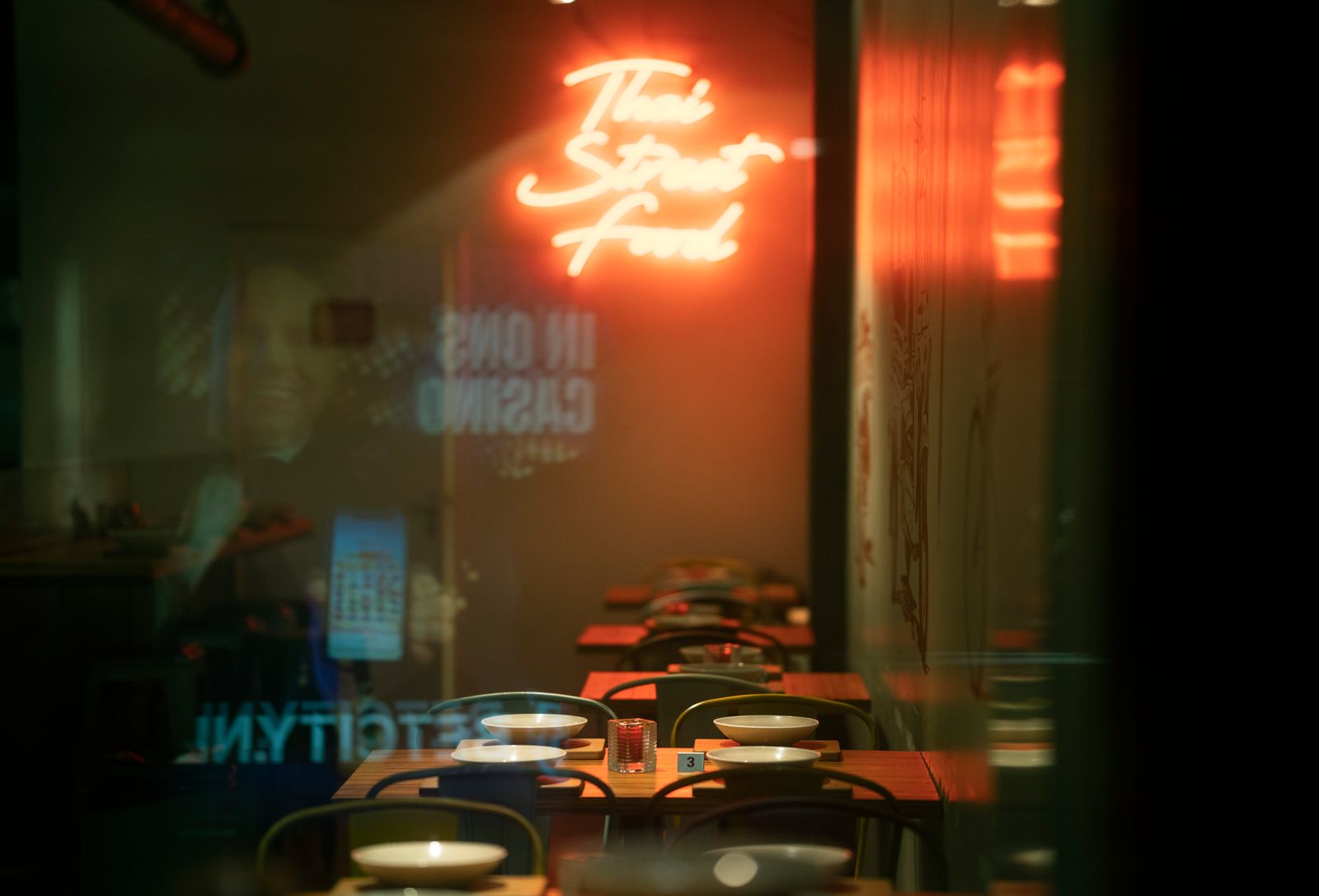 Cozy Thai street-food cafe interior with warm lighting
