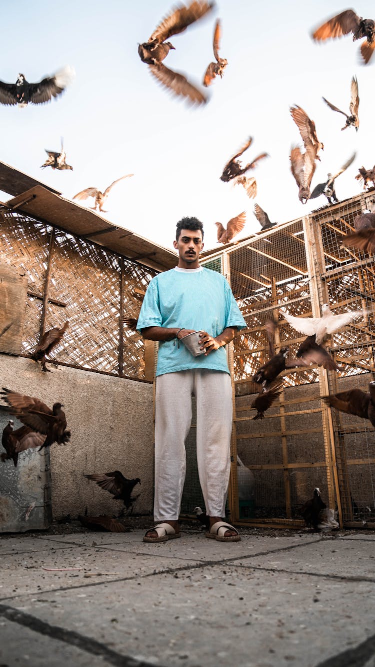 Man Standing By A Dovecote 