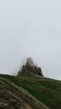 A majestic misty mountain peak in Switzerland, perfect for adventure and exploration.