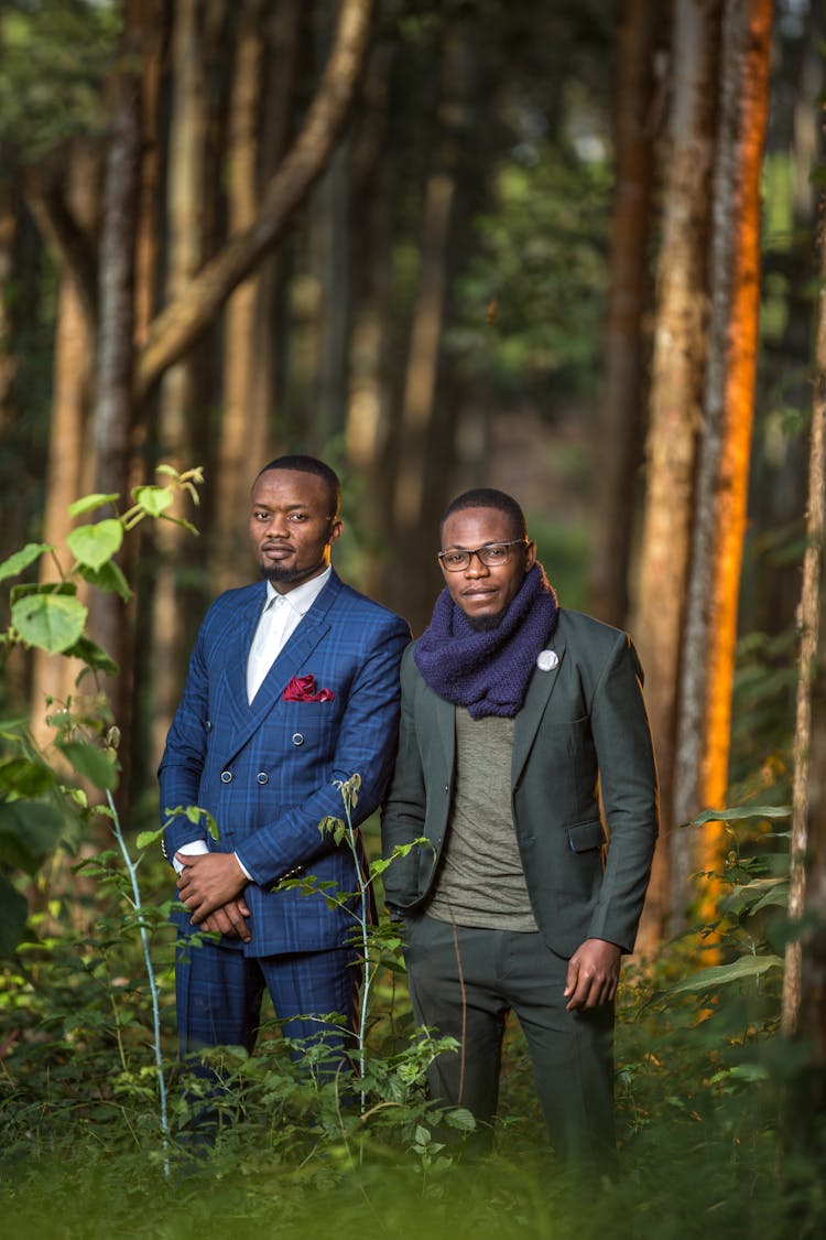 Men In Suits Posing In Forest