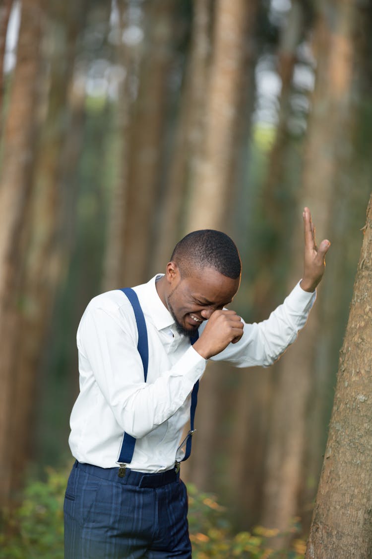 A Man Laughing In A Forest