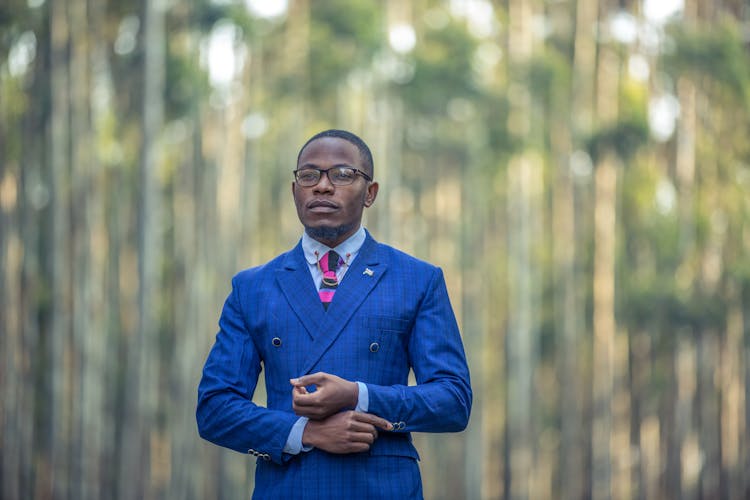 A Portrait Of A Man In A Blue Suit