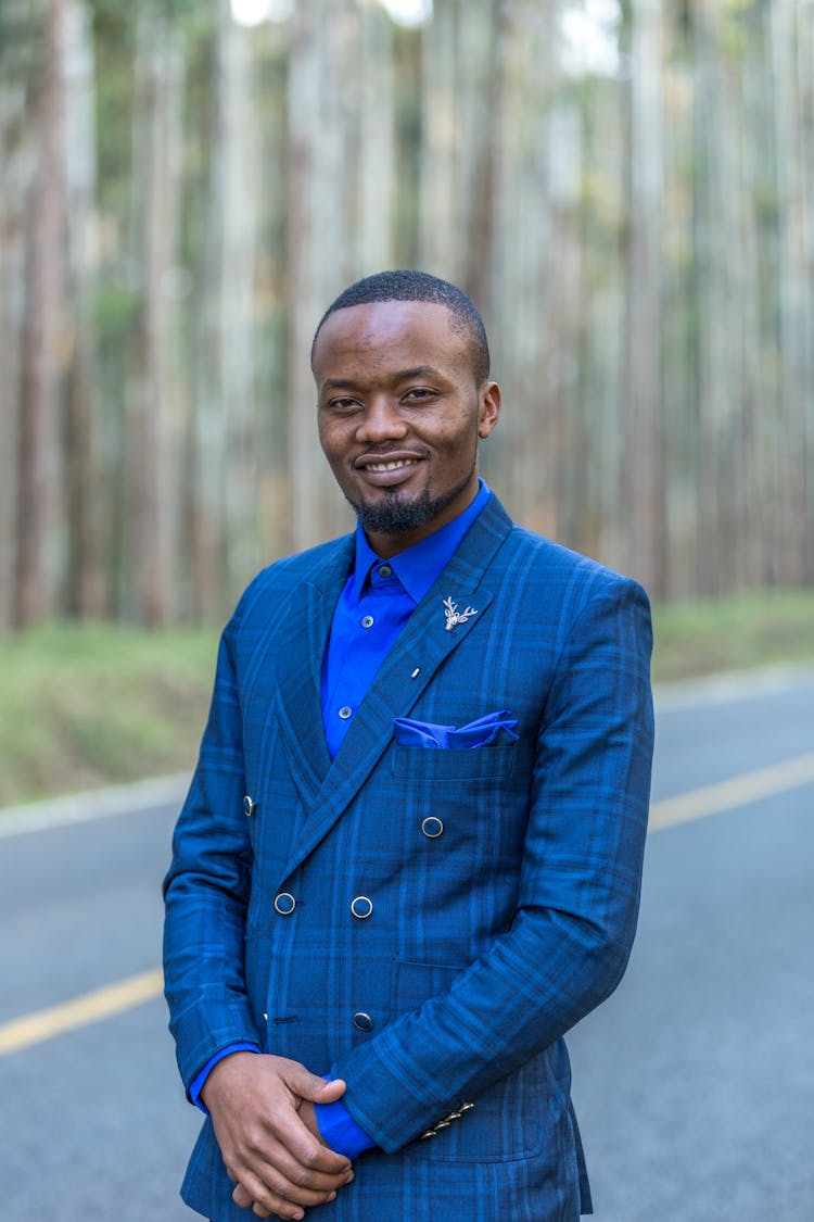 A Portrait Of A Man In A Blue Suit