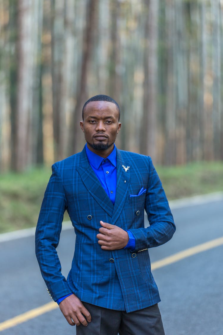 A Portrait Of A Man In A Blue Suit