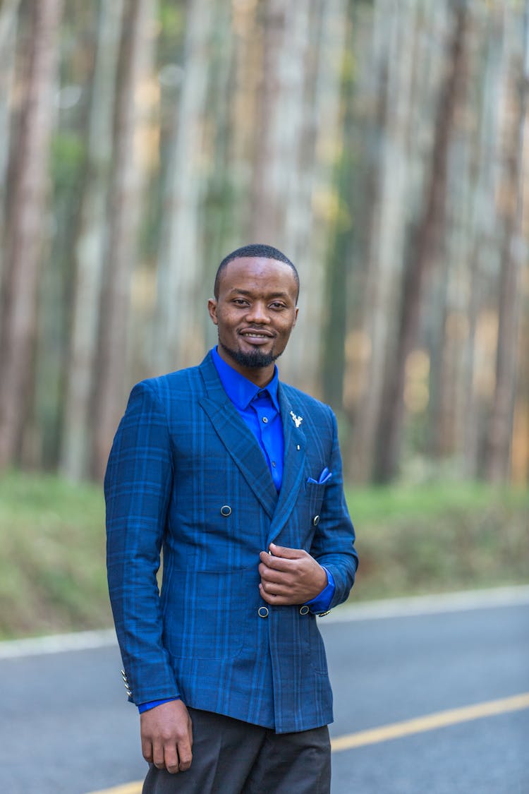 A Portrait Of A Man In A Blue Suit