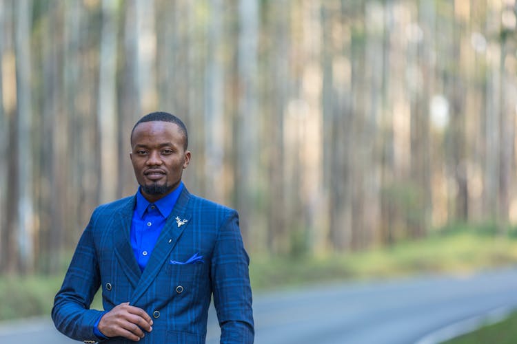 A Portrait Of A Man In A Blue Suit