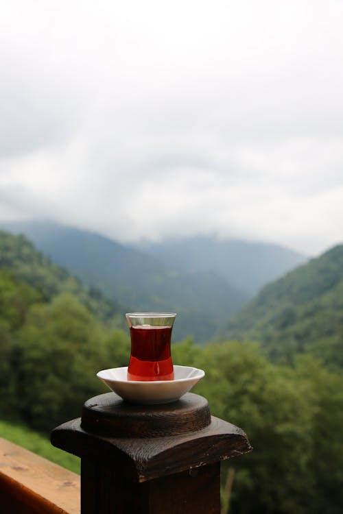 Glass of Tea against Mountains