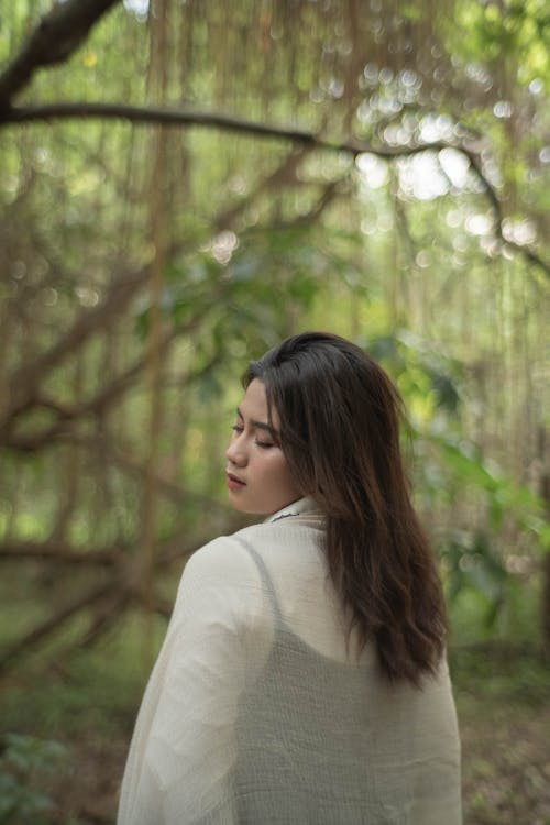 Photo of Woman Standing near to a Tree