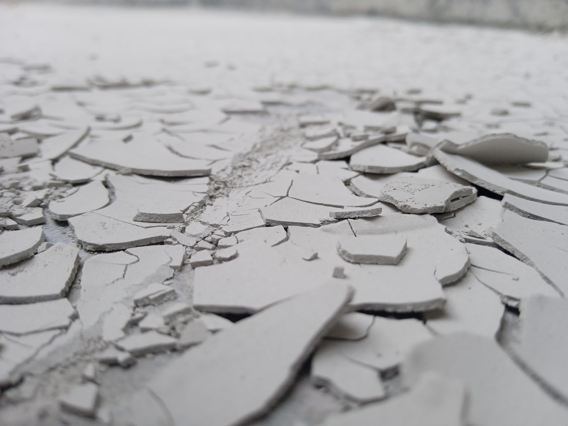 Detailed view of cracked concrete surface showing texture and pattern from Faisalabad, Pakistan.