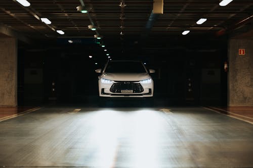 Free Photo of White Car with Headlights On Stock Photo
