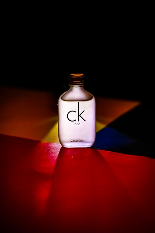 Calvin Klein Perfume Bottle on a Red Surface