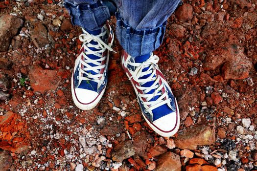 Person in Blue Denim Jeans in Blue and White Sneakers