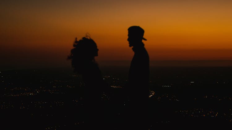Silhouettes Of Woman And Man