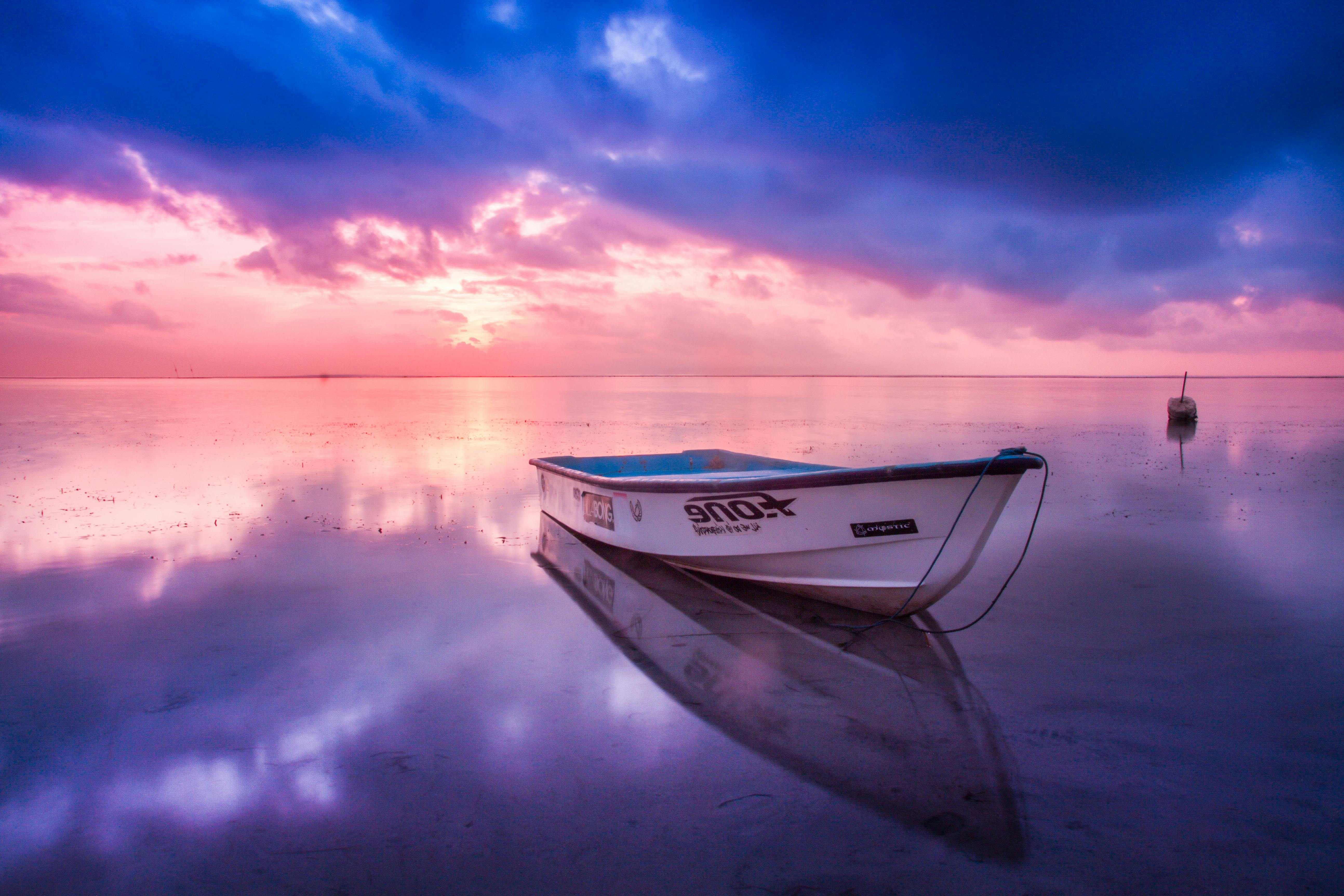 Blue And White Boat On Body Of Water · Free Stock Photo