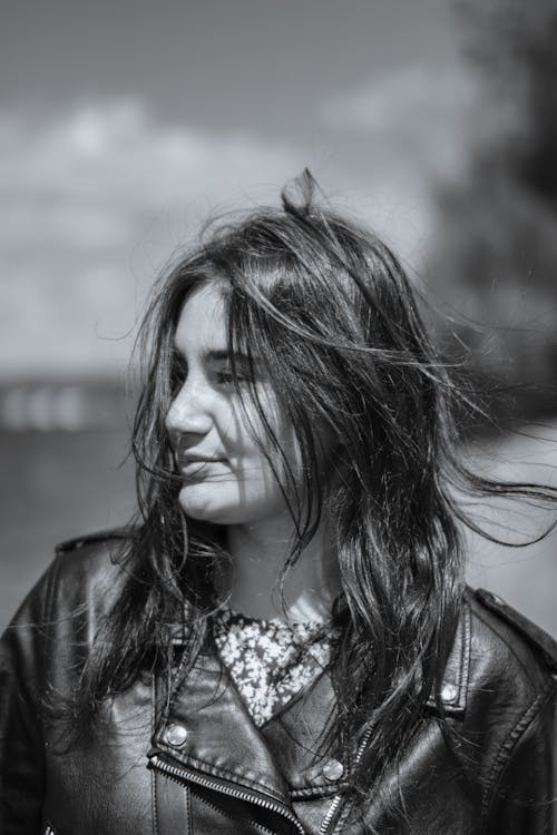 Free Grayscale Portrait of a Woman in a Leather Jacket Stock Photo