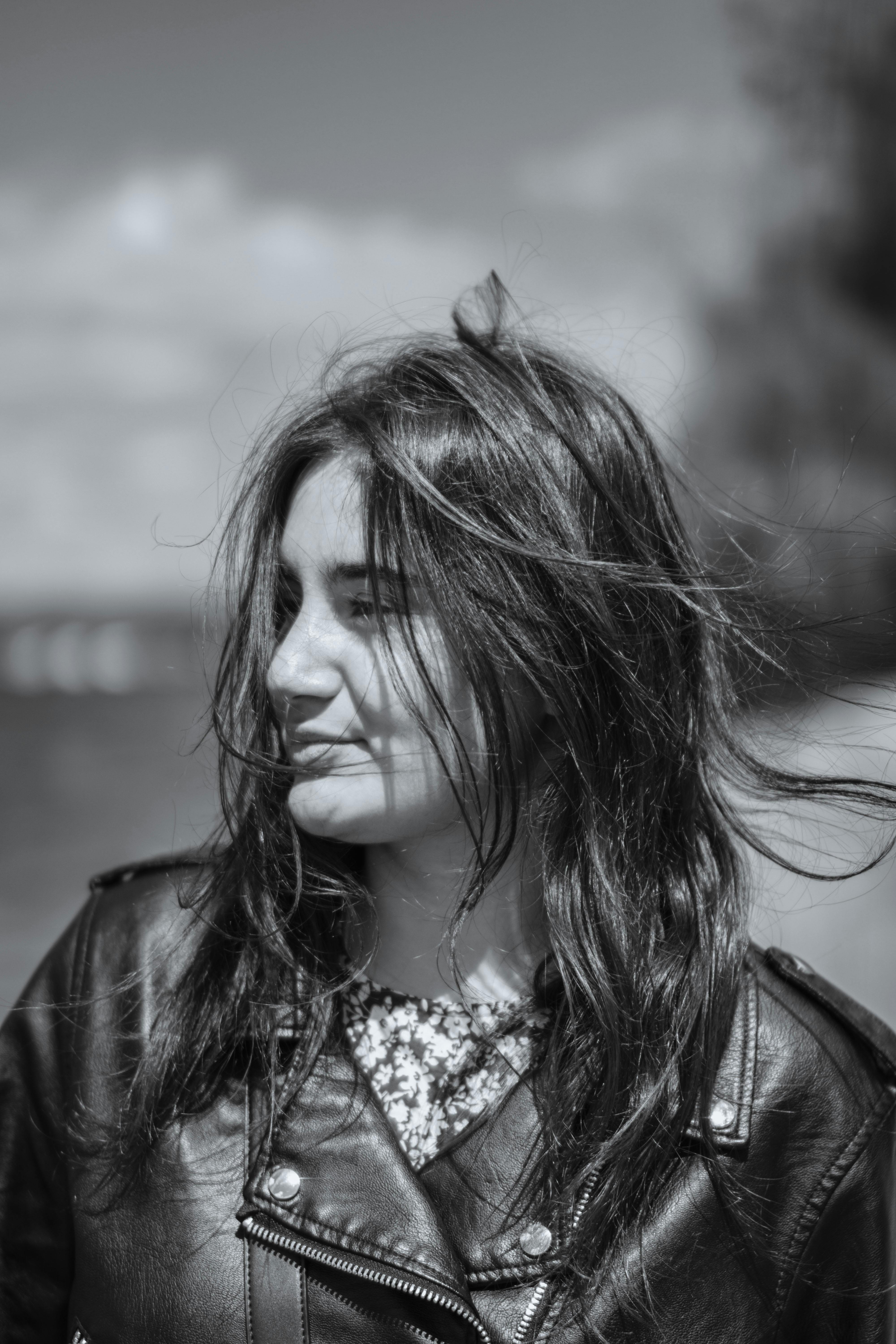 Monochrome Photo of a Girl Wearing a Denim Jacket · Free Stock Photo