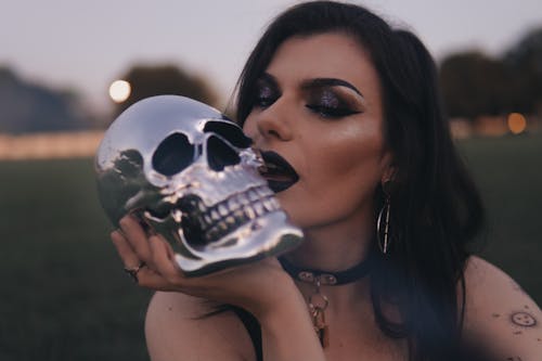 A Woman Holding a Skull