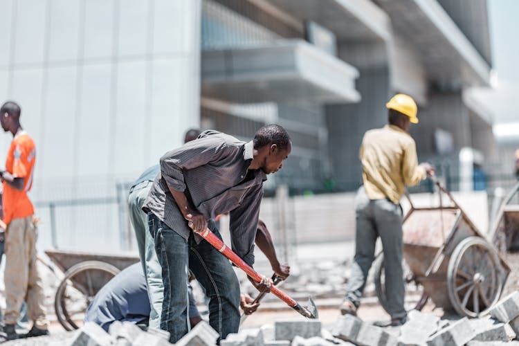 Construction Workers Working On Street Road