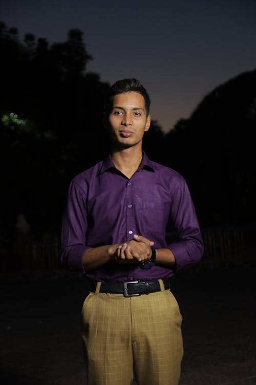 Man in Purple Shirt and Brown Pants