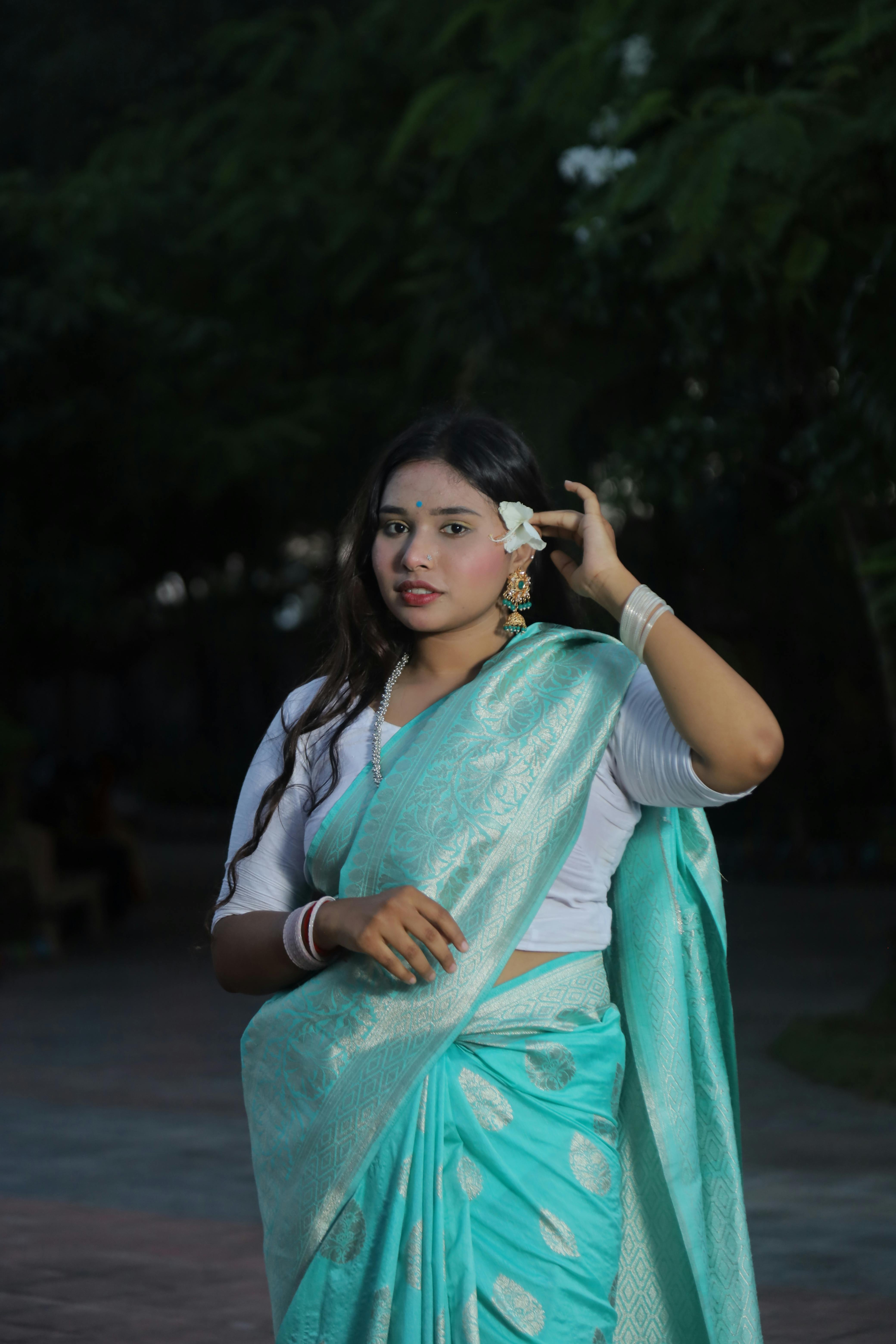 Image of Indian traditional Beautiful Woman Wearing an traditional Saree  And Posing On The Outdoor With a Smile Face-AC593056-Picxy