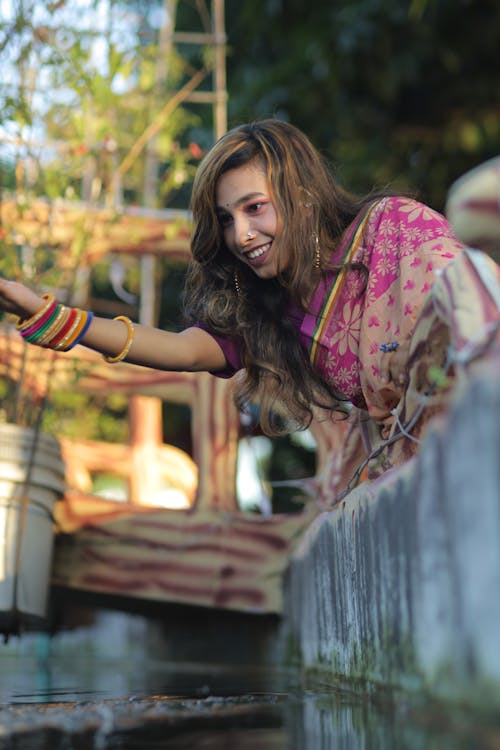 Smiling Woman Playing with Water 