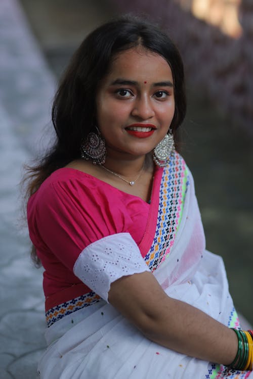Woman in Pink and White Top Wearing a Saree