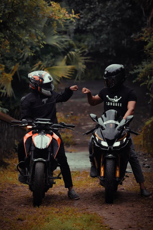 Free Persons Riding Motorcycles Fist Bumping Stock Photo