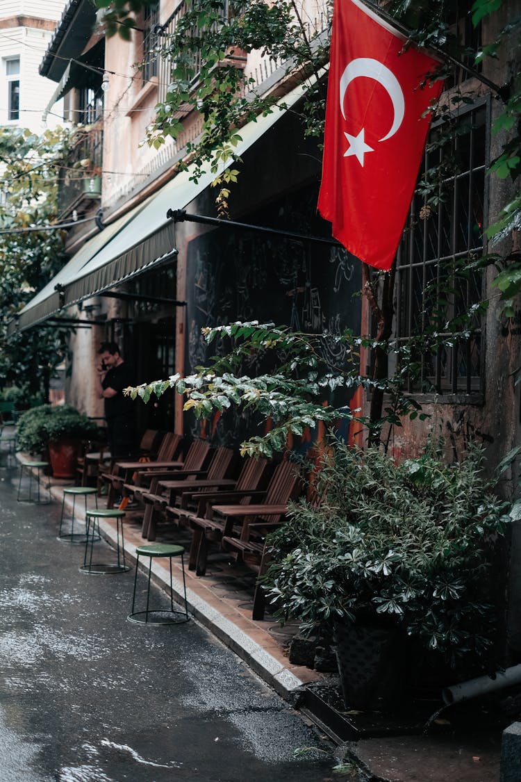 Flag Of Turkey Hanging Outside A Family House