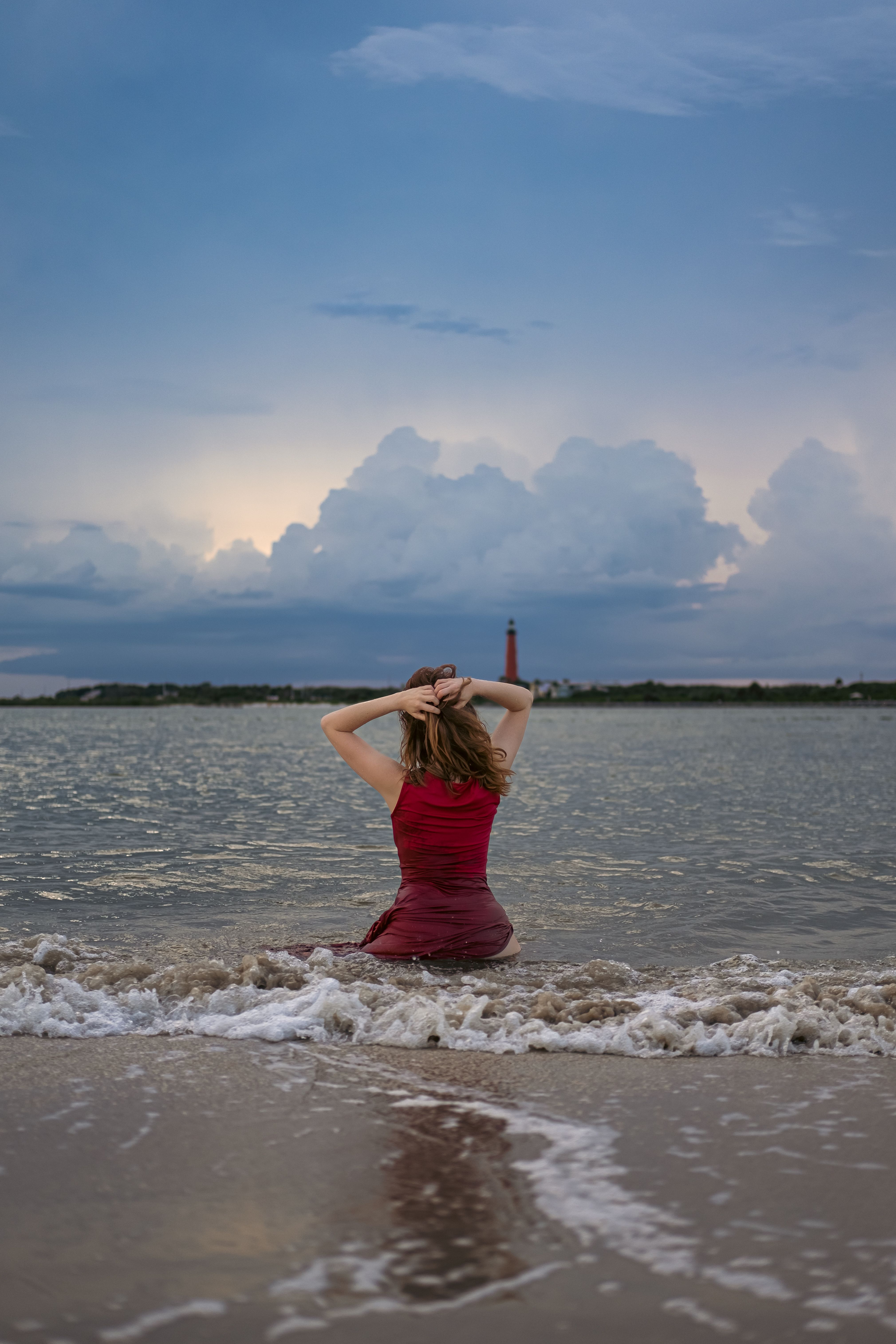 Woman in White Shirt Standing on Gray Rock Near Body of Water · Free ...
