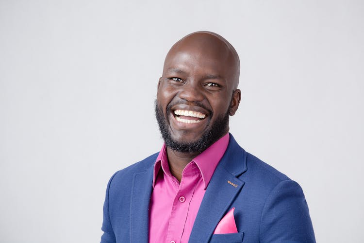 Portrait Of Smiling Businessman On White Background