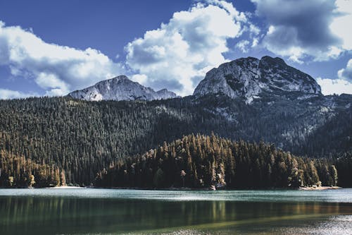 Cloudy Sky over a Mountain and a Lake