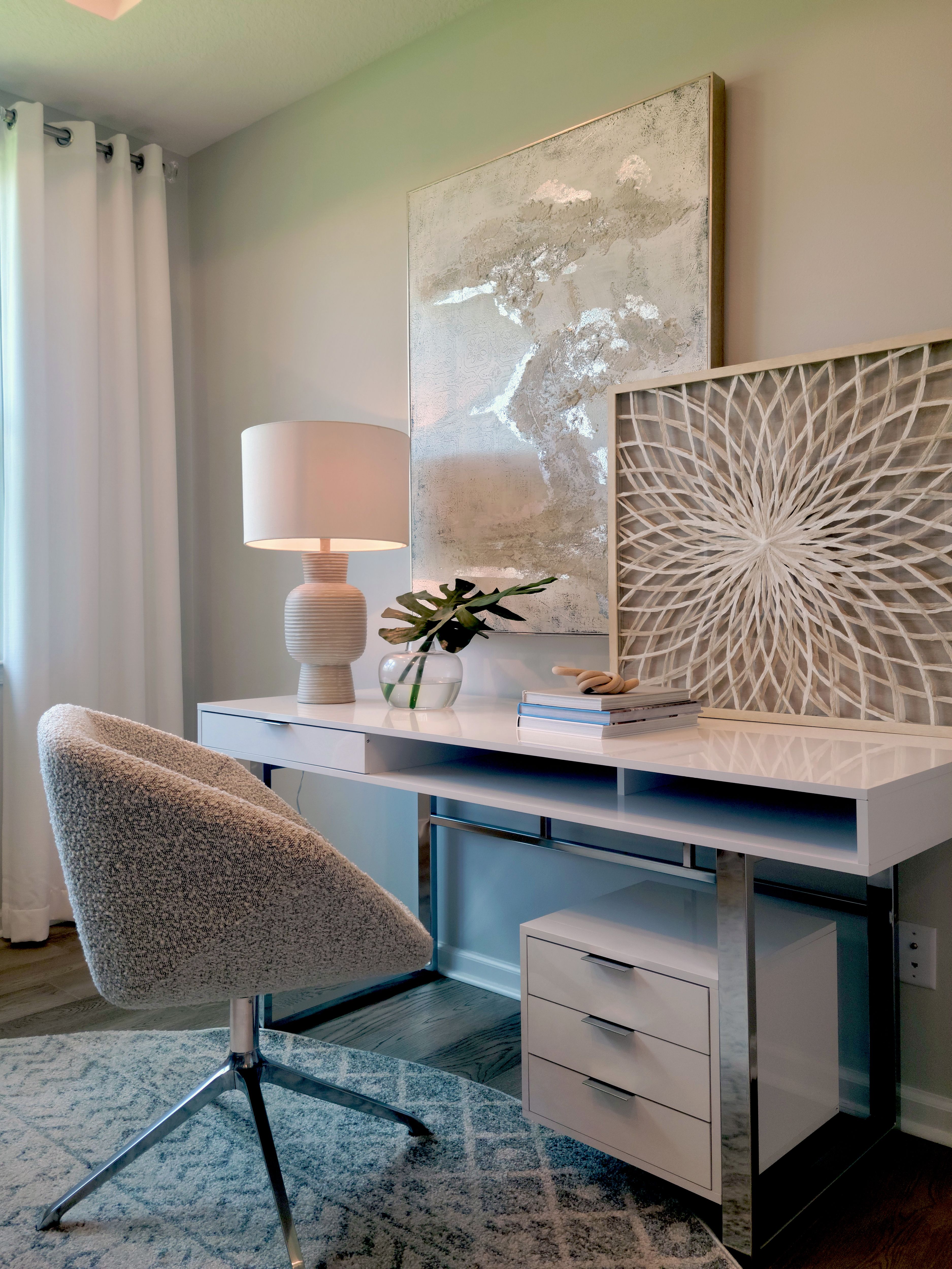 Contemporary minimalist home office setup with modern furniture and decor.