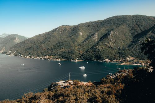 Free A breathtaking aerial view of the Adriatic Sea near Herceg Novi, Montenegro, showcasing lush greenery and boats. Stock Photo