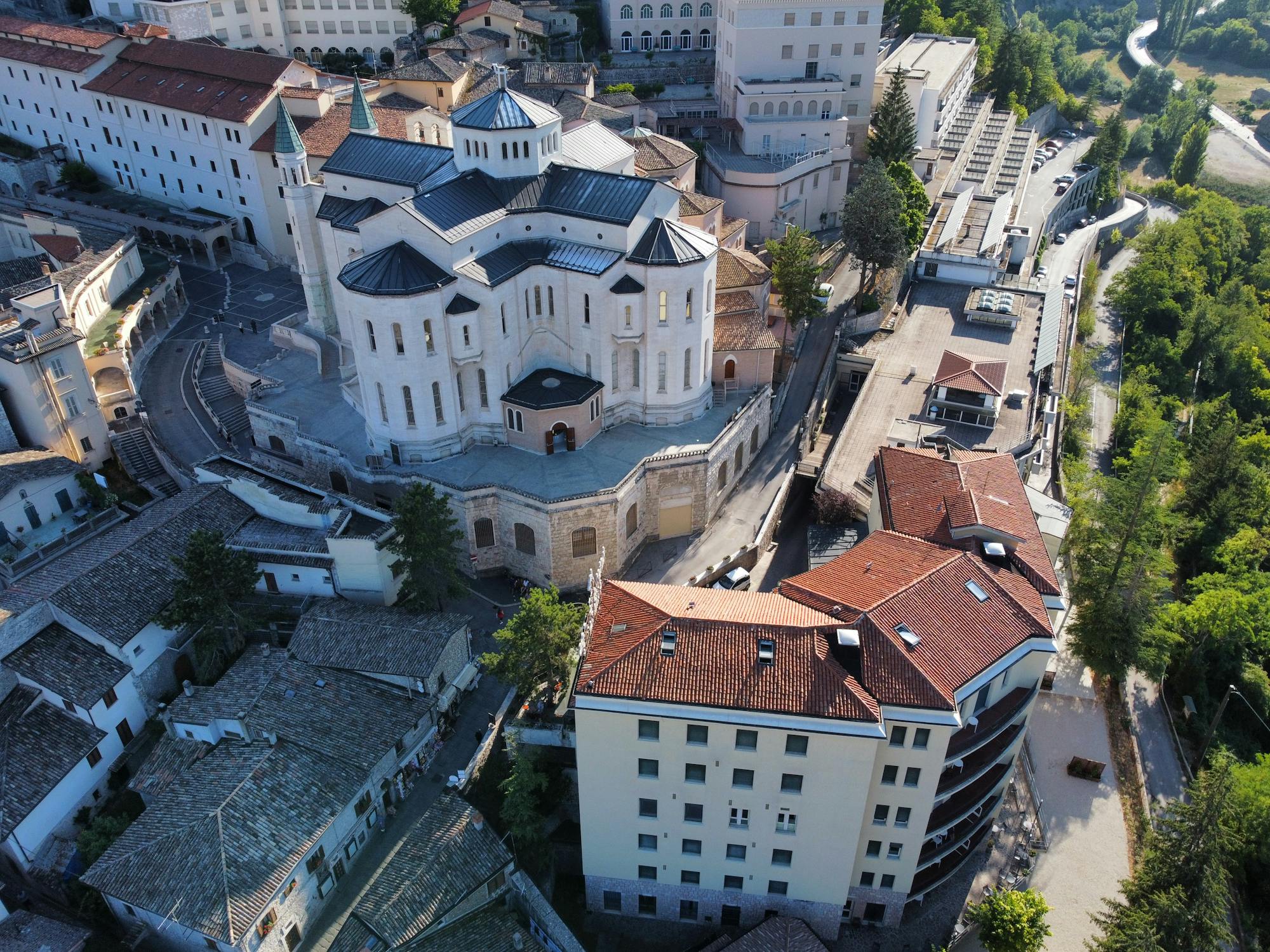 Aerial view of San Biago Basilica Church and surrounding buildings in Italy