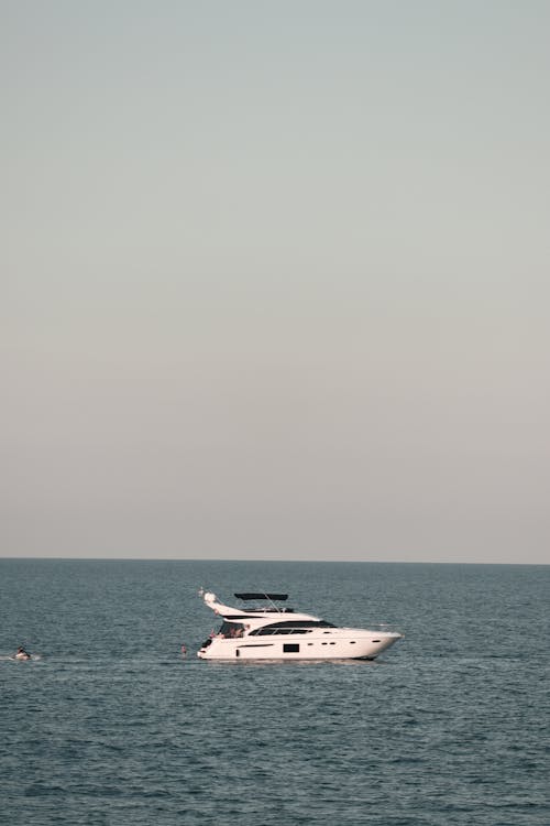 Free White and Black Yacht on Sea Stock Photo