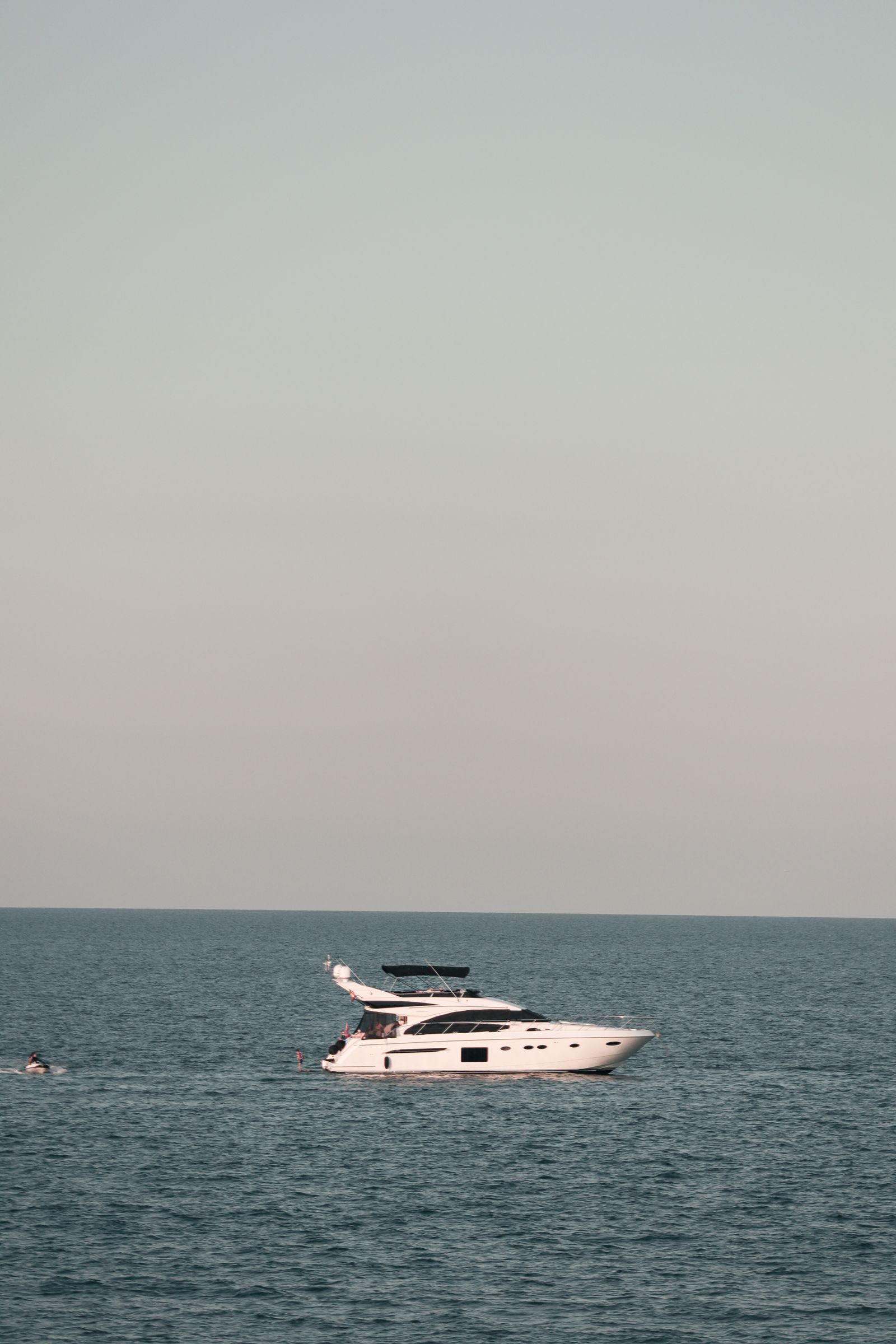 yacht charter Marbella — White luxury yacht on serene Mediterranean Sea