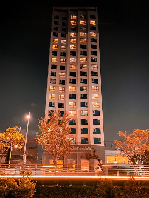 Free Stunning night view of a high-rise building in Ulsan, South Korea, with illuminated windows. Stock Photo