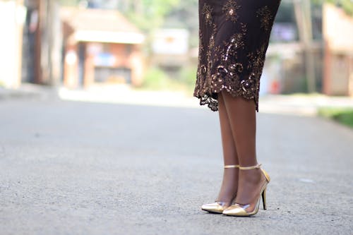 Woman Wearing Gold High Heels