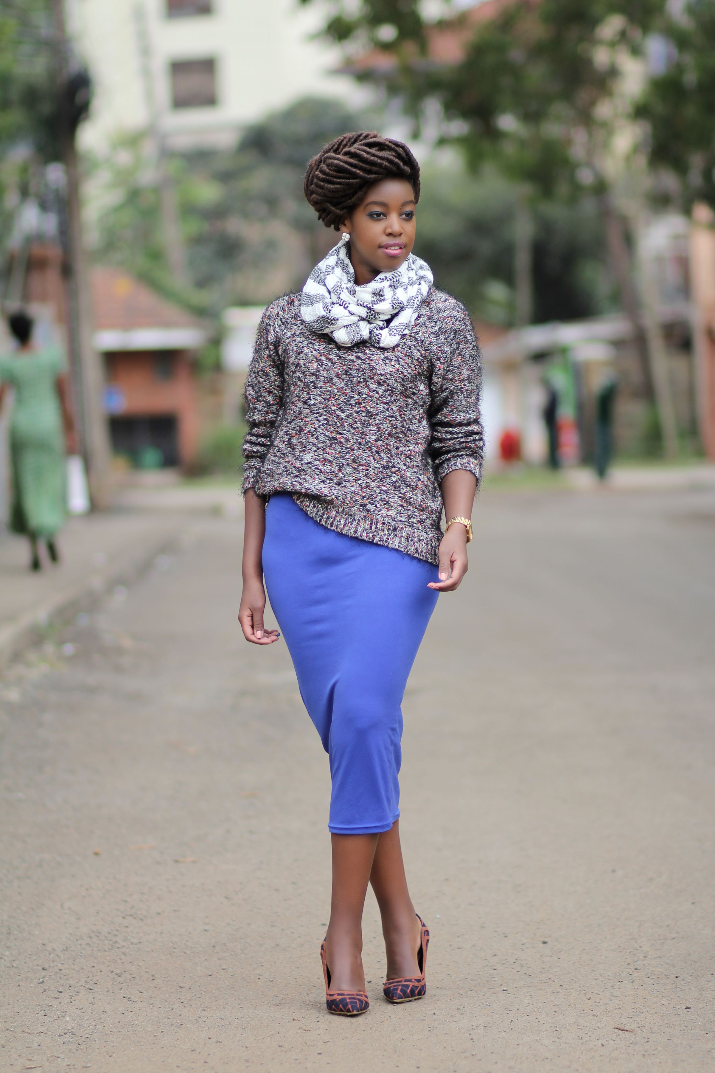 A Woman with Dreadlocks Wearing Black Sweater and Plaid Skirt · Free ...