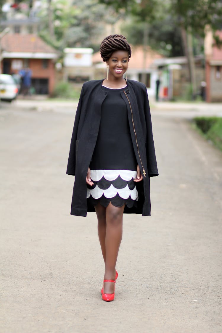 Smiling Woman In Black Coat Posing 