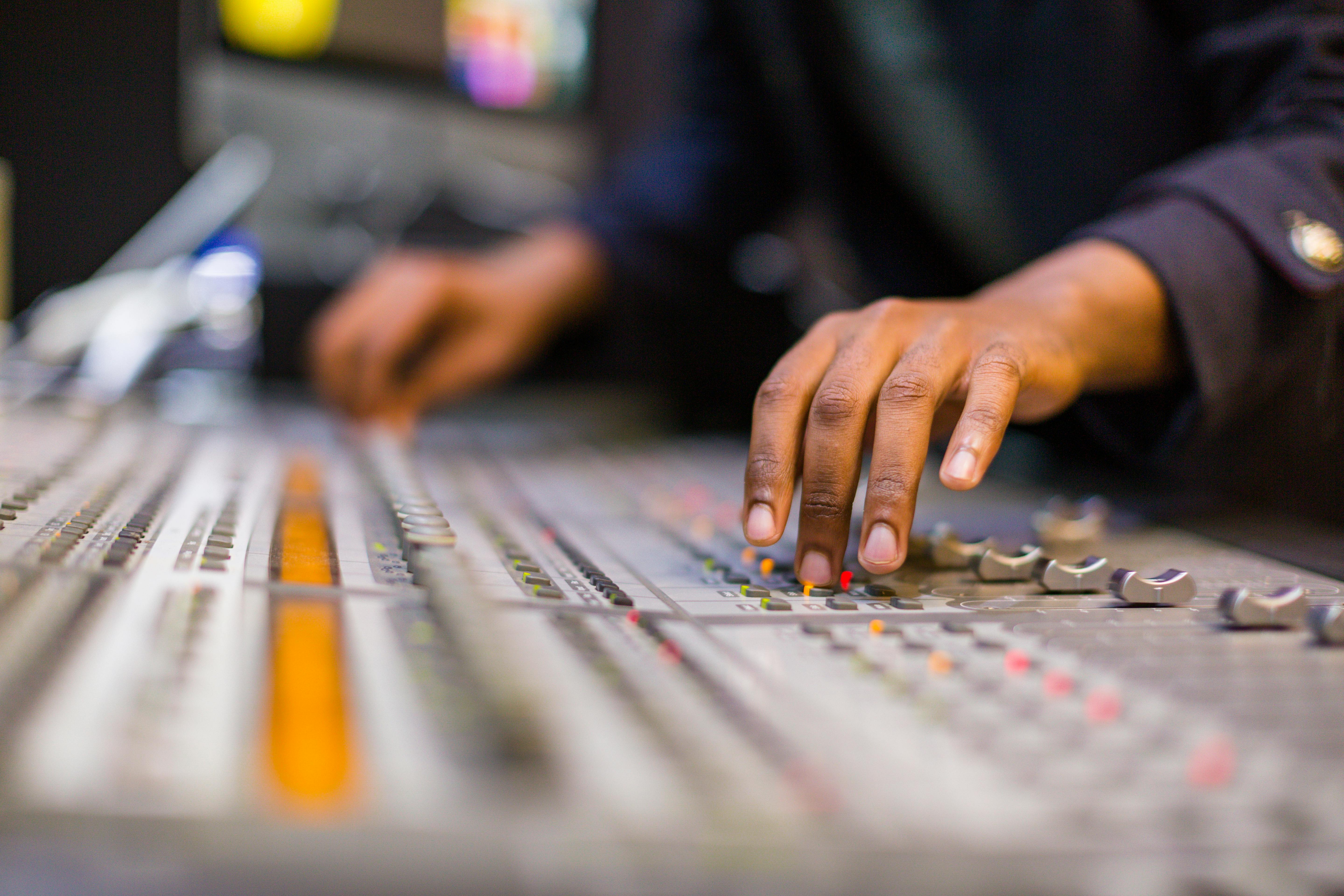 A Person Using a Soundboard · Free Stock Photo