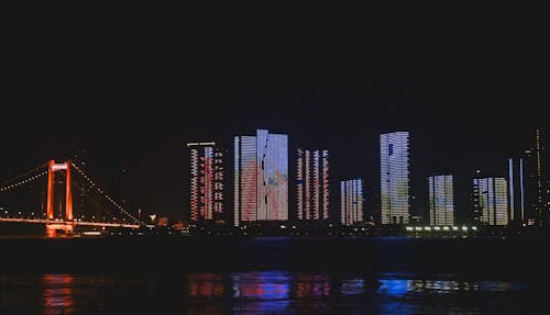 High Rise Buildings in the City during Nighttime
