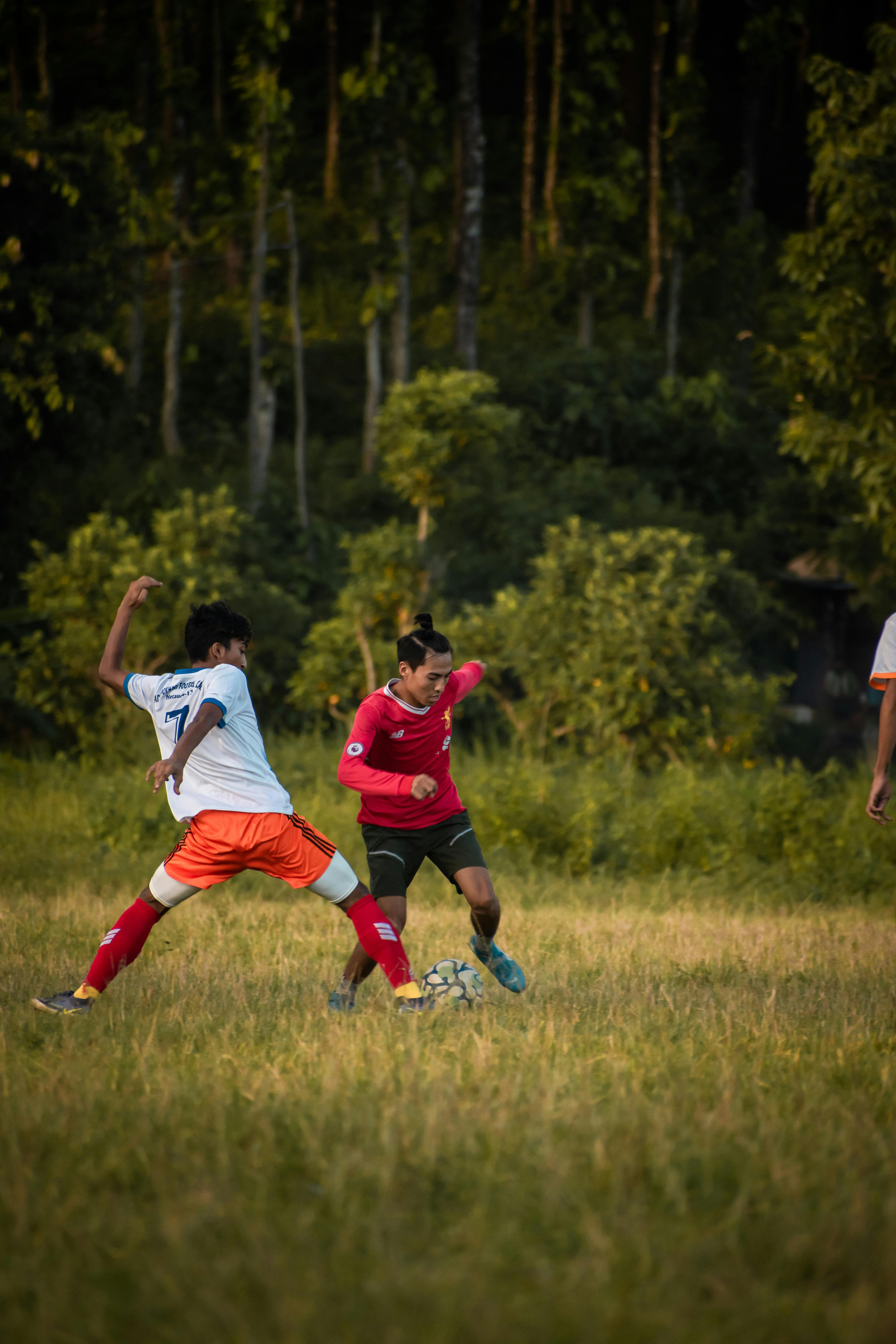 men playing soccer in the field