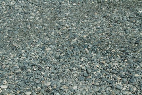Free An expansive view of smooth pebbles and stones on a beach in Cyprus, ideal for backgrounds. Stock Photo